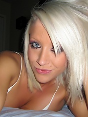 Monroe Lee gets naked on her bed.